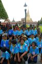 Thai school students wearing uniforms visit The Grand Palace in Bangkok, Thailand.