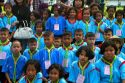 Thai school students wearing uniforms visit The Grand Palace in Bangkok, Thailand.