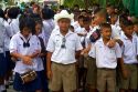 Thai school students wearing uniforms visit The Grand Palace in Bangkok, Thailand.