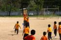 Students play basketball at a Thai elementary school playground on the island of Ko Samui, Thailand.