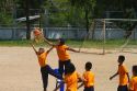 Students play basketball at a Thai elementary school playground on the island of Ko Samui, Thailand.