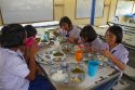 Thai elementary school students eat lunch on the island of Ko Samui, Thailand.