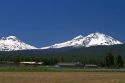 Three sisters mountains along U.S. Route 20 at Sisters, Oregon, USA.