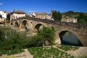 Six-arched Roman bridge spanning the Arga River on the Way of St. James pilgrimage route in Puente La Reina, Navarra, Spain.