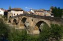 Six-arched Roman bridge spanning the Arga River on the Way of St. James pilgrimage route in Puente La Reina, Navarra, Spain.