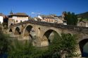 Six-arched Roman bridge spanning the Arga River on the Way of St. James pilgrimage route in Puente La Reina, Navarra, Spain.