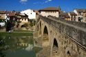 Six-arched Roman bridge spanning the Arga River on the Way of St. James pilgrimage route in Puente La Reina, Navarra, Spain.