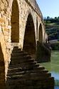Six-arched Roman bridge spanning the Arga River on the Way of St. James pilgrimage route in Puente La Reina, Navarra, Spain.
